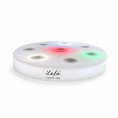 Interactive LED Sensory Board with illuminated touch points on a white background