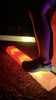 Child stepping across an LED sensory balance beam