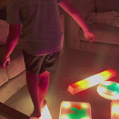 Child using the Lola Sense Lab LED Sensory Trail Set